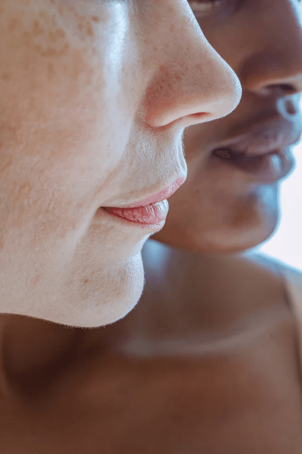 Close-up profile showing natural skin texture in soft light