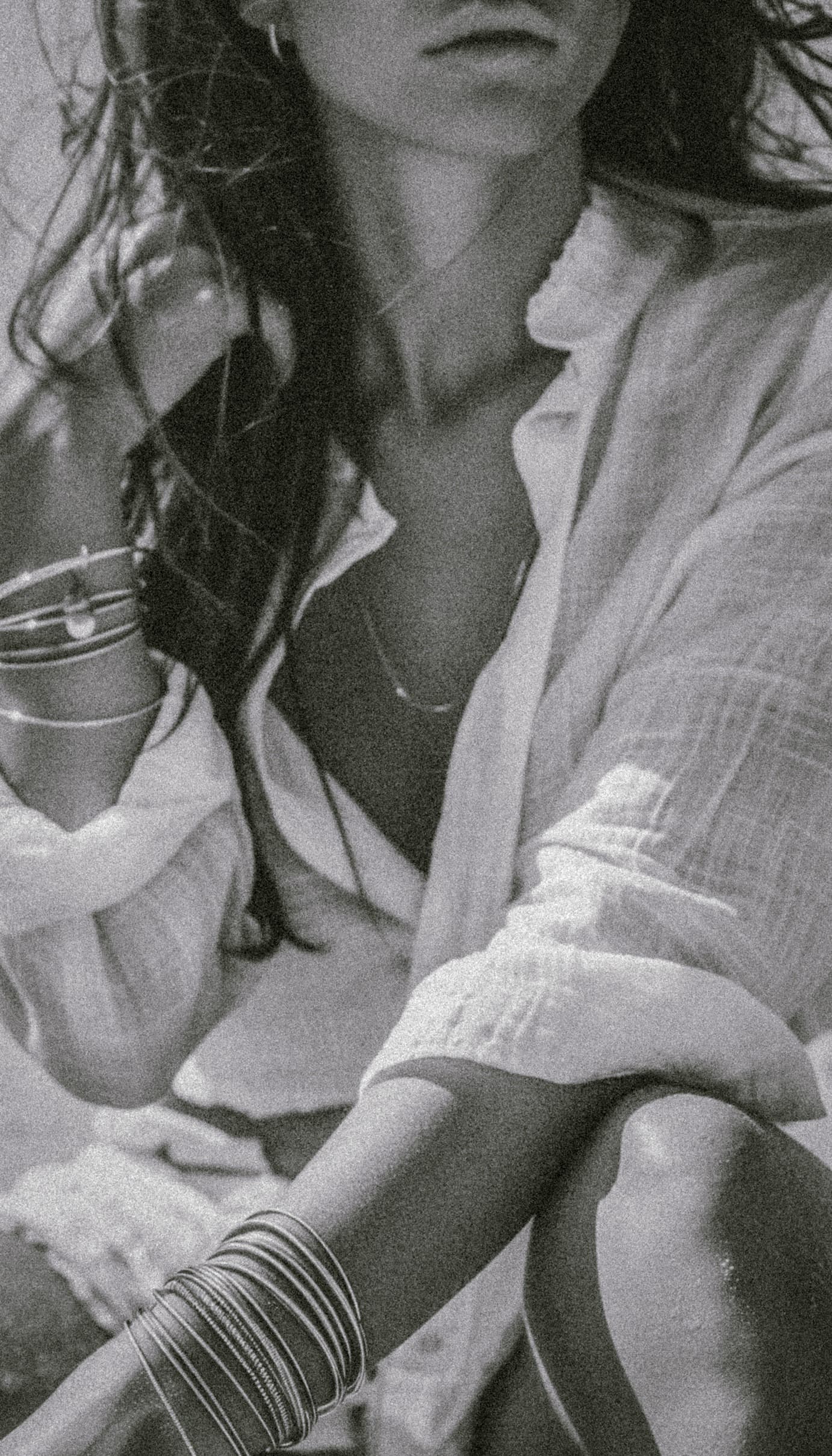 Woman in linen relaxing outdoors with coffee
